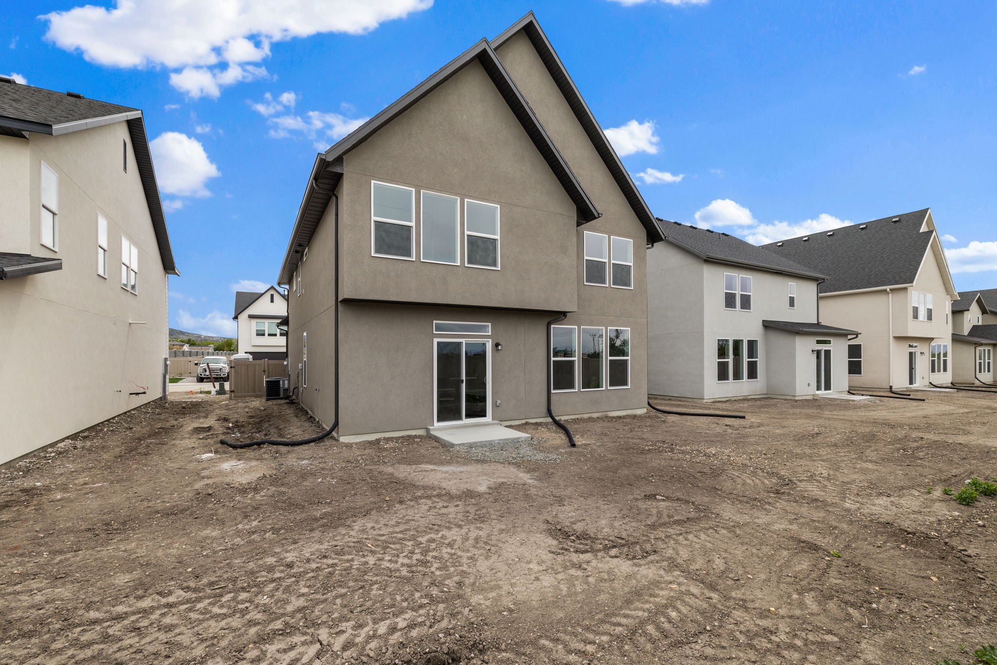 Rear view of property with stucco siding