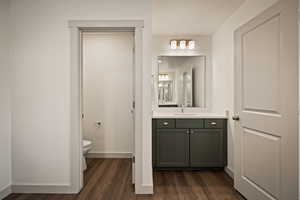 Bathroom with vanity and dark wood finished floors