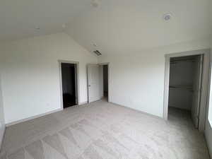 Primary bedroom.  Vaulted ceiling.