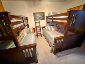 Bedroom with light colored carpet