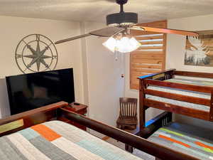 Bedroom featuring a textured ceiling