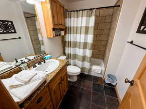 Full bathroom with vanity and shower / bathtub combination with curtain