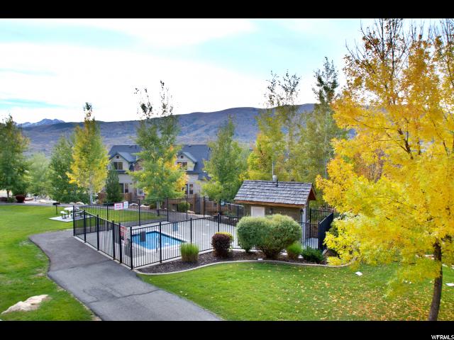 View of property's community with a swimming pool and a mountain view