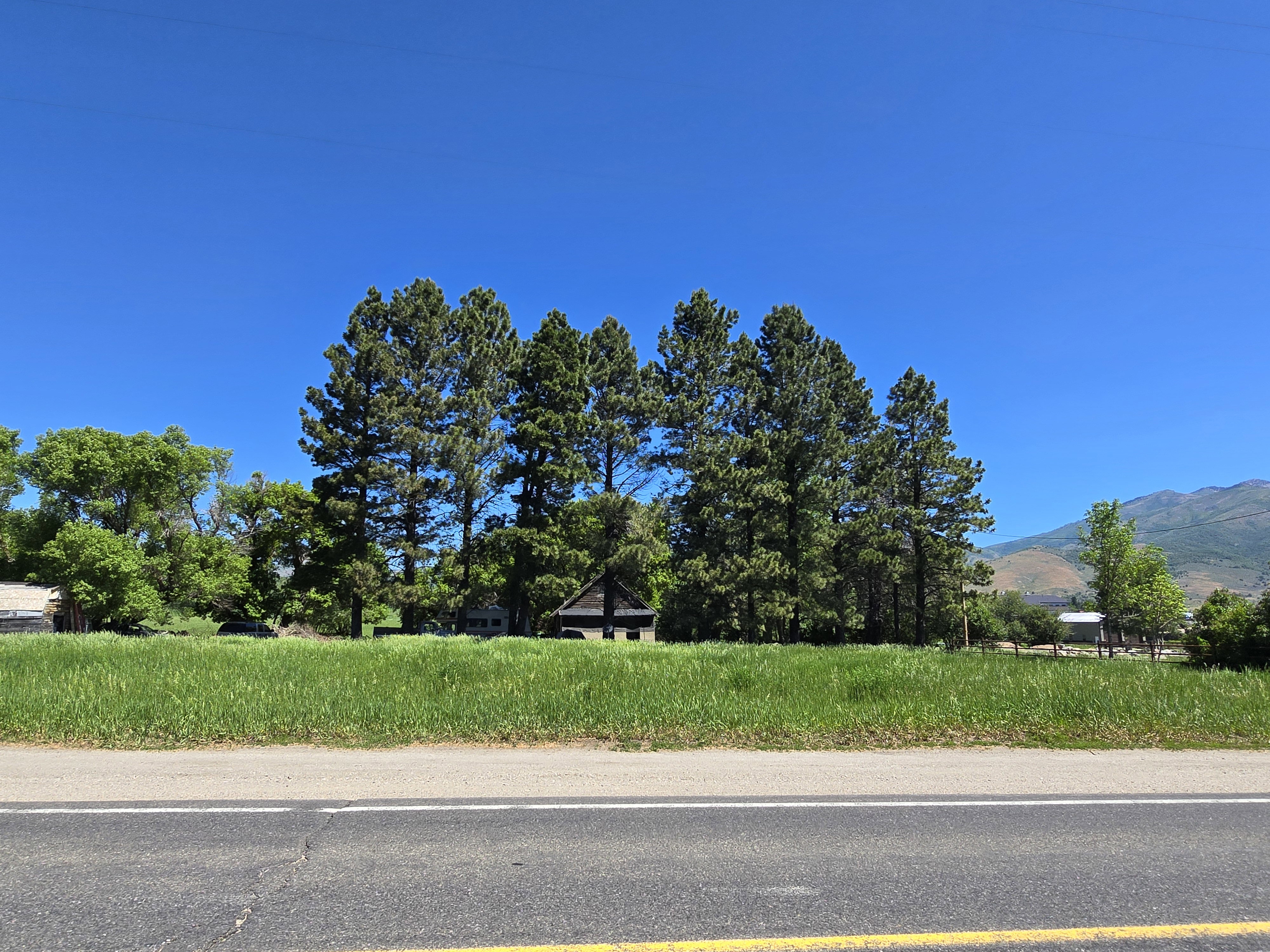 View of asphalt street with a mountain view