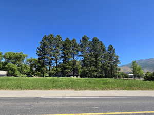 View of asphalt street with a mountain view