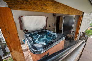 Exterior view of covered jacuzzi.