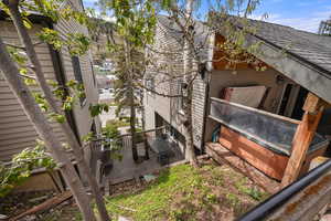 View of home's exterior from upper walkway.