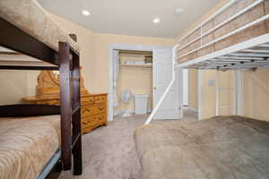 Guest bedroom sleeps six comfortably, with closet and dresser.