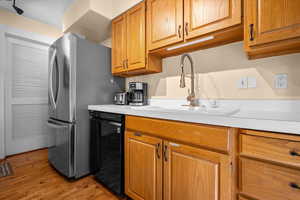 Kitchen featuring solid wood cabinetry, and equipped with coffee maker.