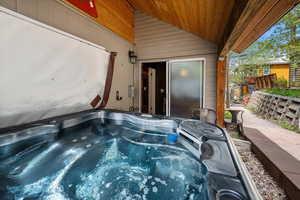 View of patio / terrace with a hot tub