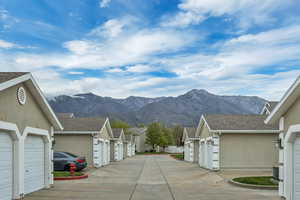 View of mountain backdrop featuring nearby suburban area