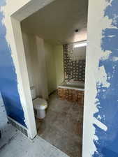 Full bathroom featuring toilet