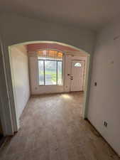 Foyer entrance featuring arched walkways