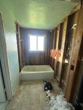 Bathroom featuring a textured ceiling
