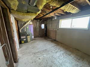 Below grade area featuring heating unit