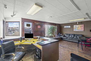 Office area with wooden walls