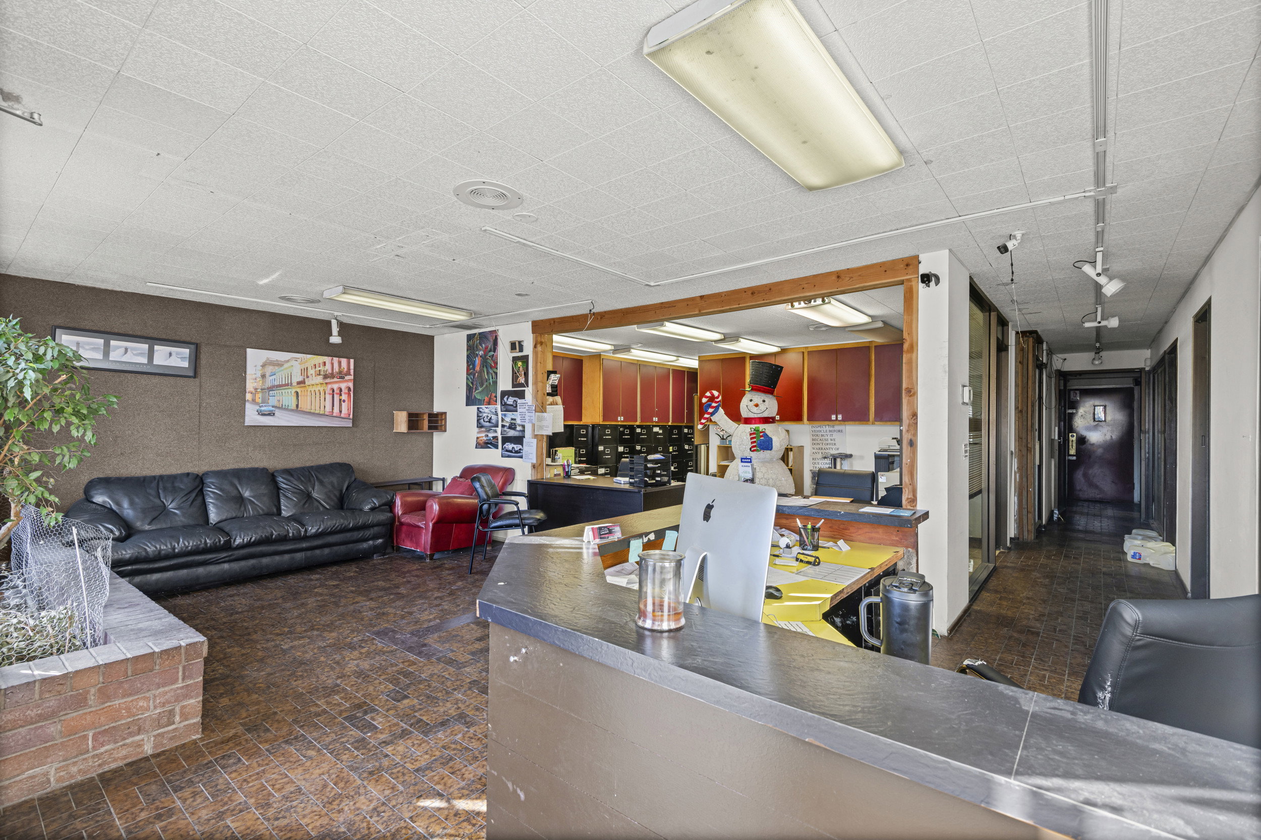 Interior space with open floor plan and dark countertops