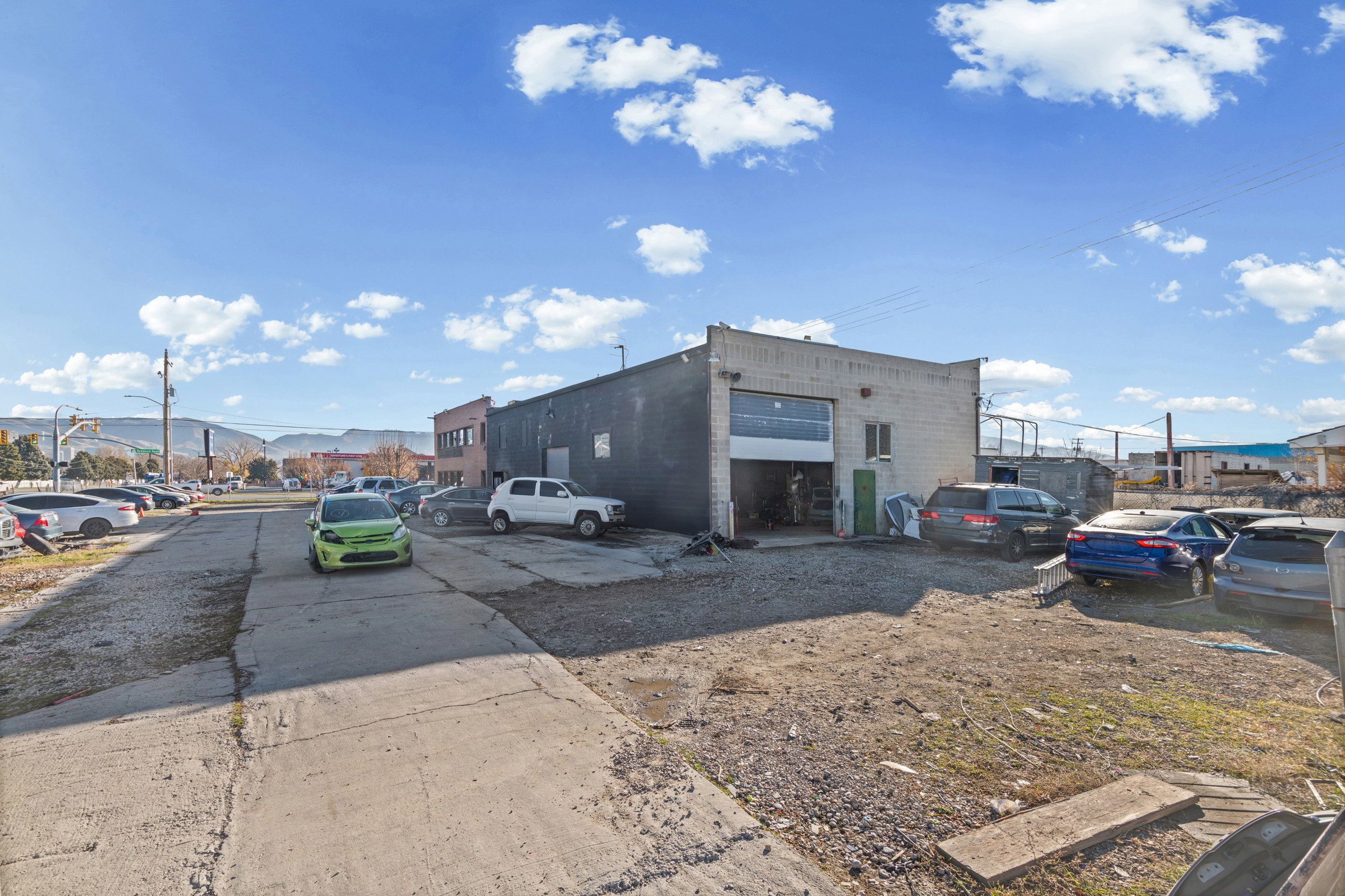 View of outdoor structure featuring uncovered parking