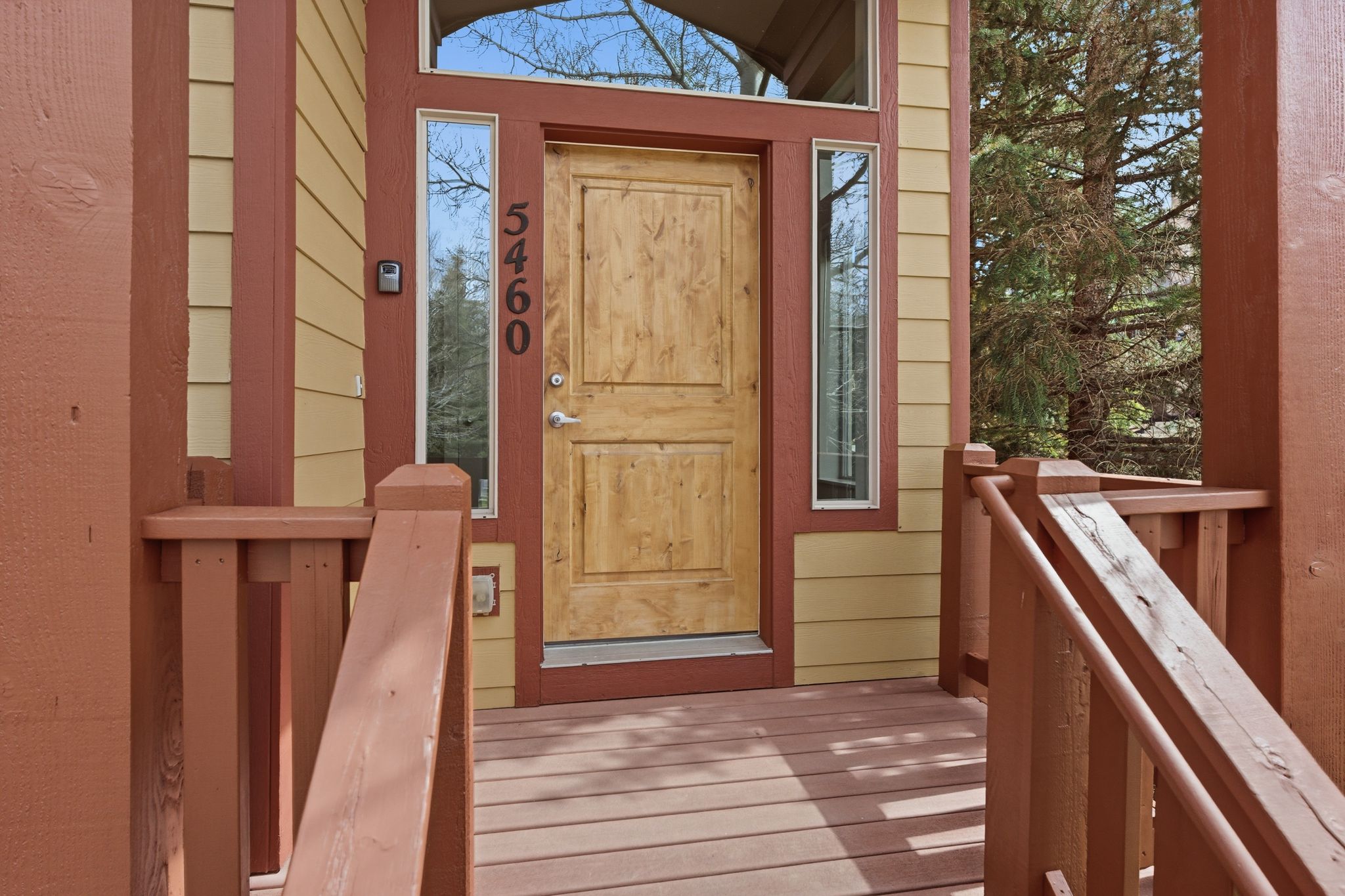 Doorway to property with a wooden deck