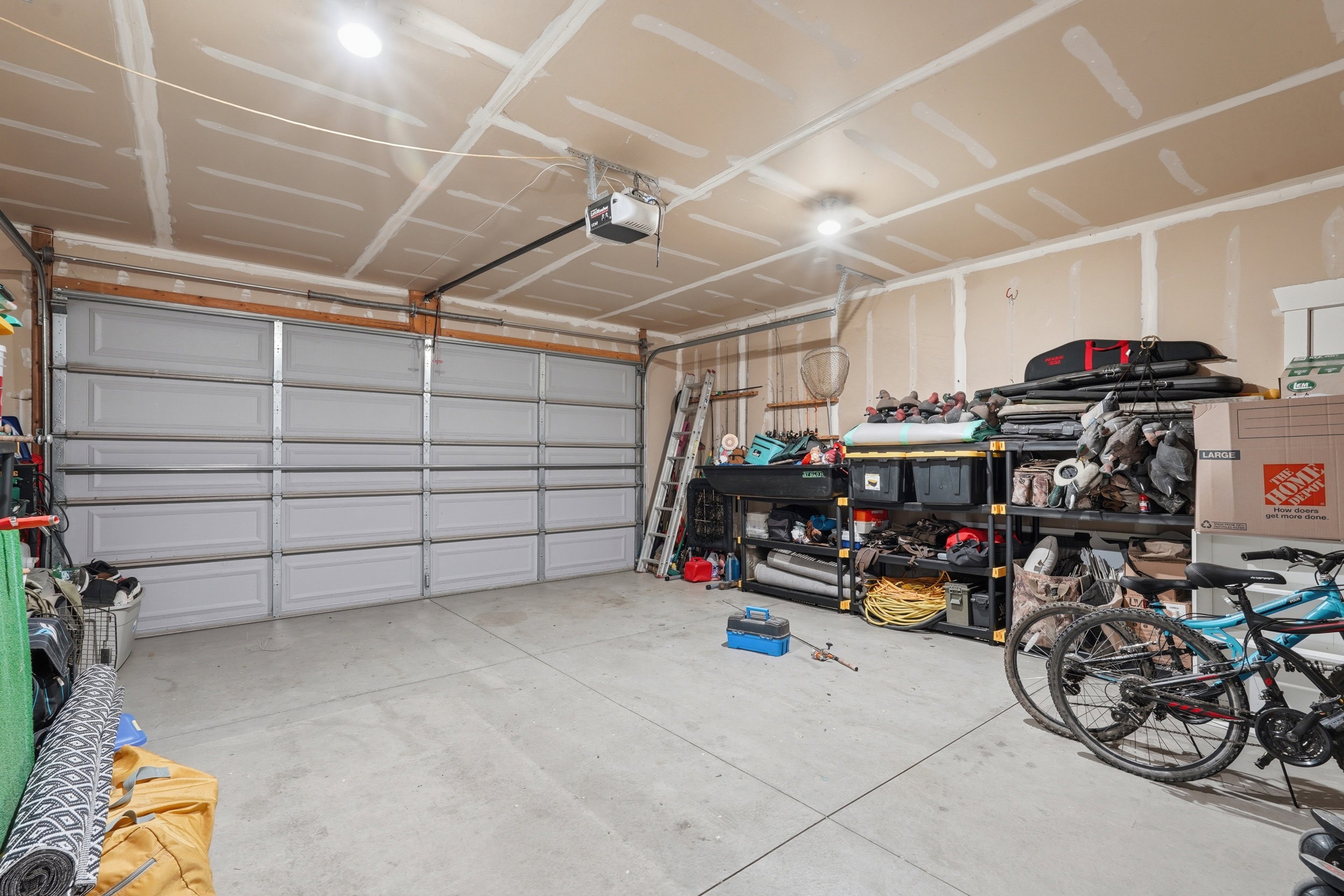 Garage featuring a garage door opener
