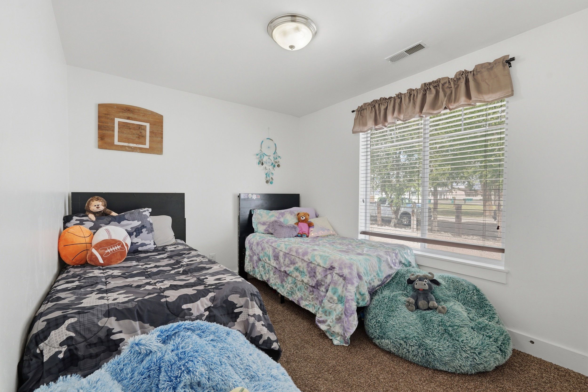 Bedroom featuring carpet flooring and baseboards