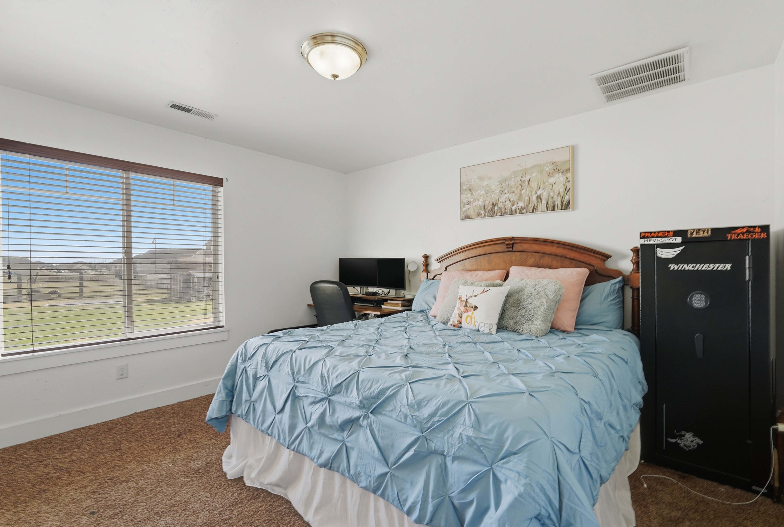 Bedroom featuring baseboards and dark colored carpet