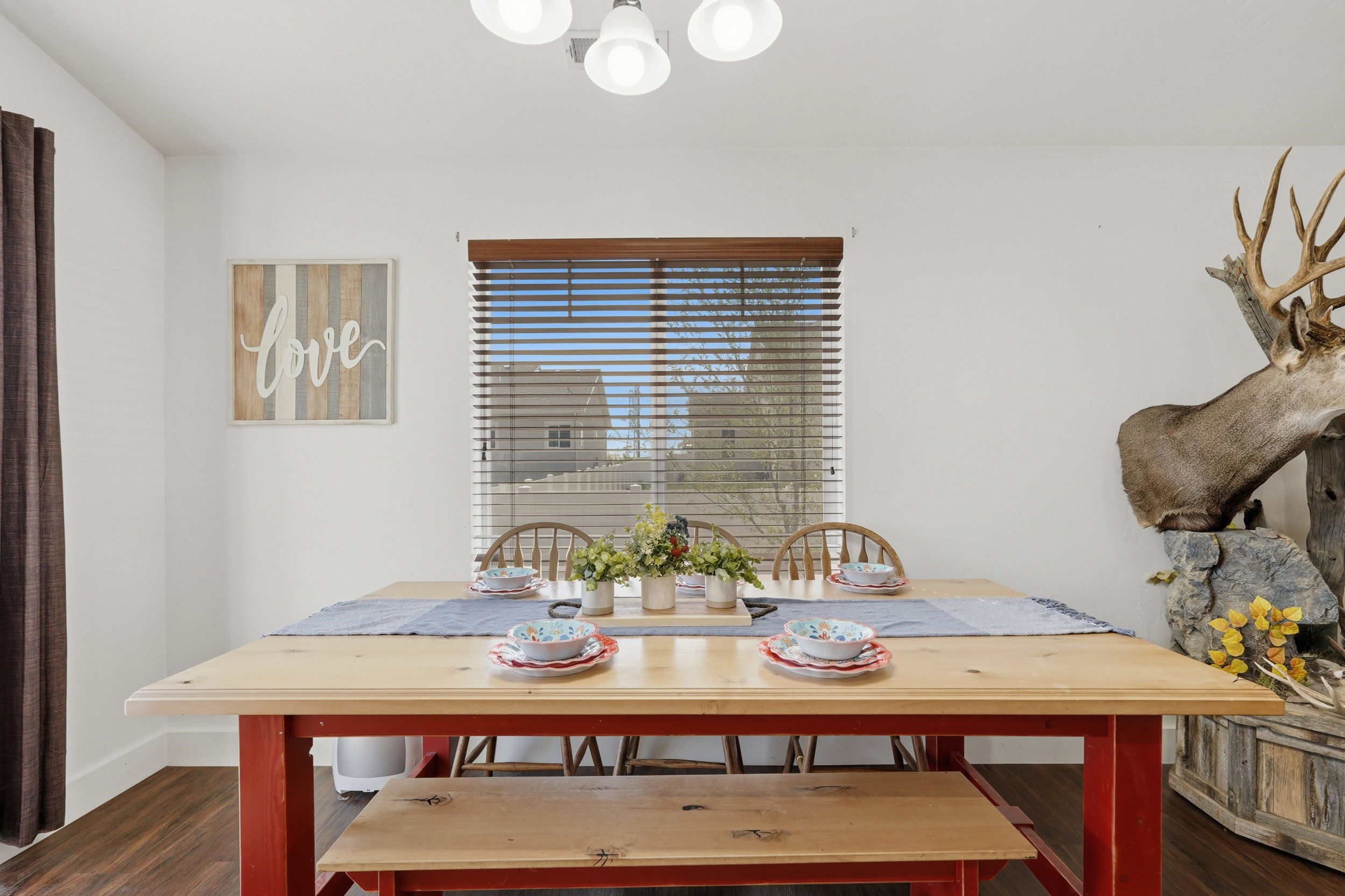 Dining space featuring dark wood finished floors and a chandelier