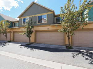 Multi-unit property with a combination of tan stucco and green siding