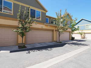 Townhome-style exterior featuring durable siding and stucco finishes