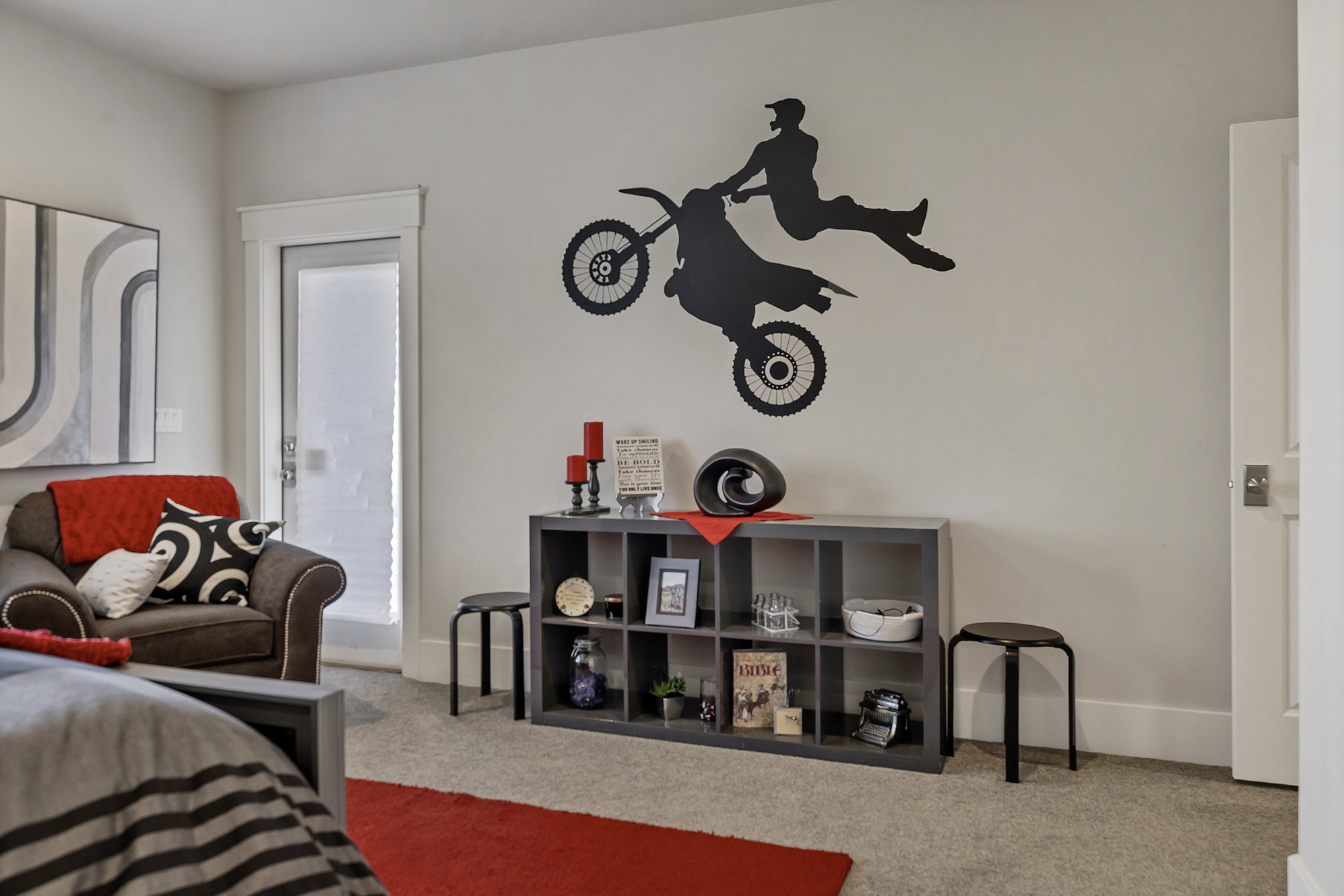 Carpeted bedroom featuring baseboards