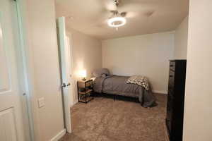 Bedroom featuring carpet flooring and ceiling fan