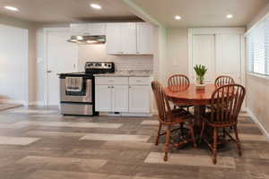 Dining area featuring recessed lighting and light wood-style floors