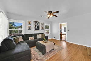 Living area featuring hardwood / wood-style floors and a ceiling fan