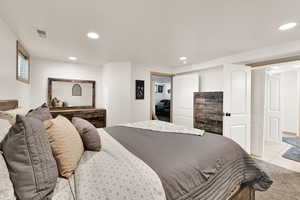 Bedroom with recessed lighting and light tile patterned flooring