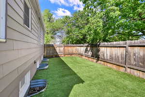View of fenced backyard