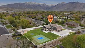 Aerial perspective of suburban area featuring a mountain backdrop