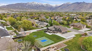 Aerial perspective of suburban area featuring a mountain backdrop