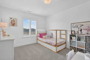 Bedroom with light carpet