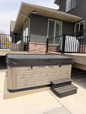 View of patio / terrace with a hot tub