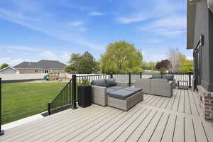 Deck featuring a playground and outdoor seating