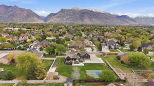 Aerial perspective of suburban area with a mountain backdrop