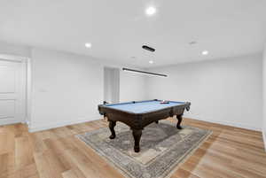 Recreation room featuring recessed lighting, billiards, and light wood-style floors