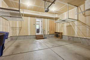 Garage featuring a garage door opener