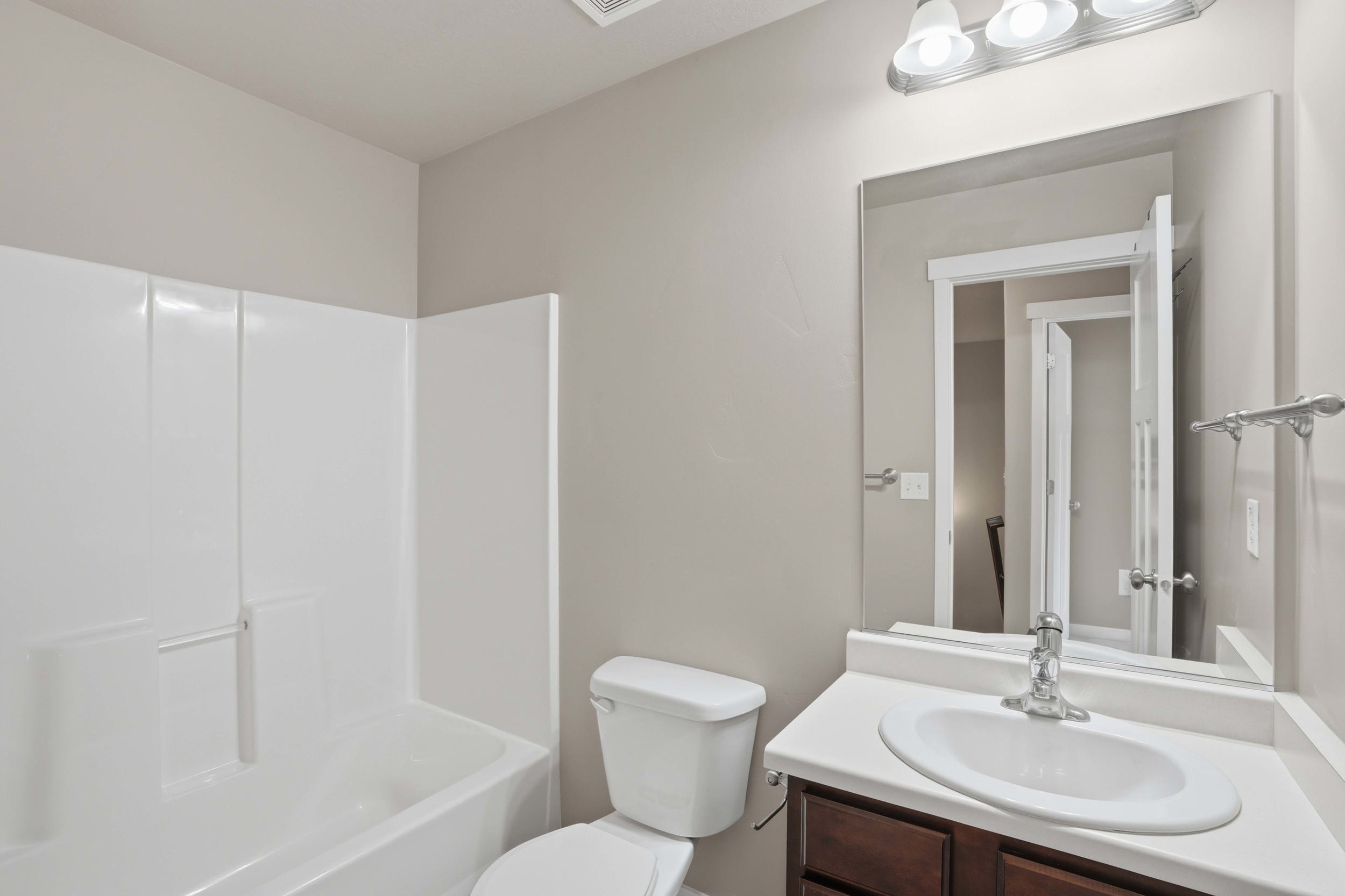 Full bathroom with vanity and shower / tub combination