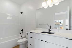 Full bathroom with vanity and bathing tub / shower combination