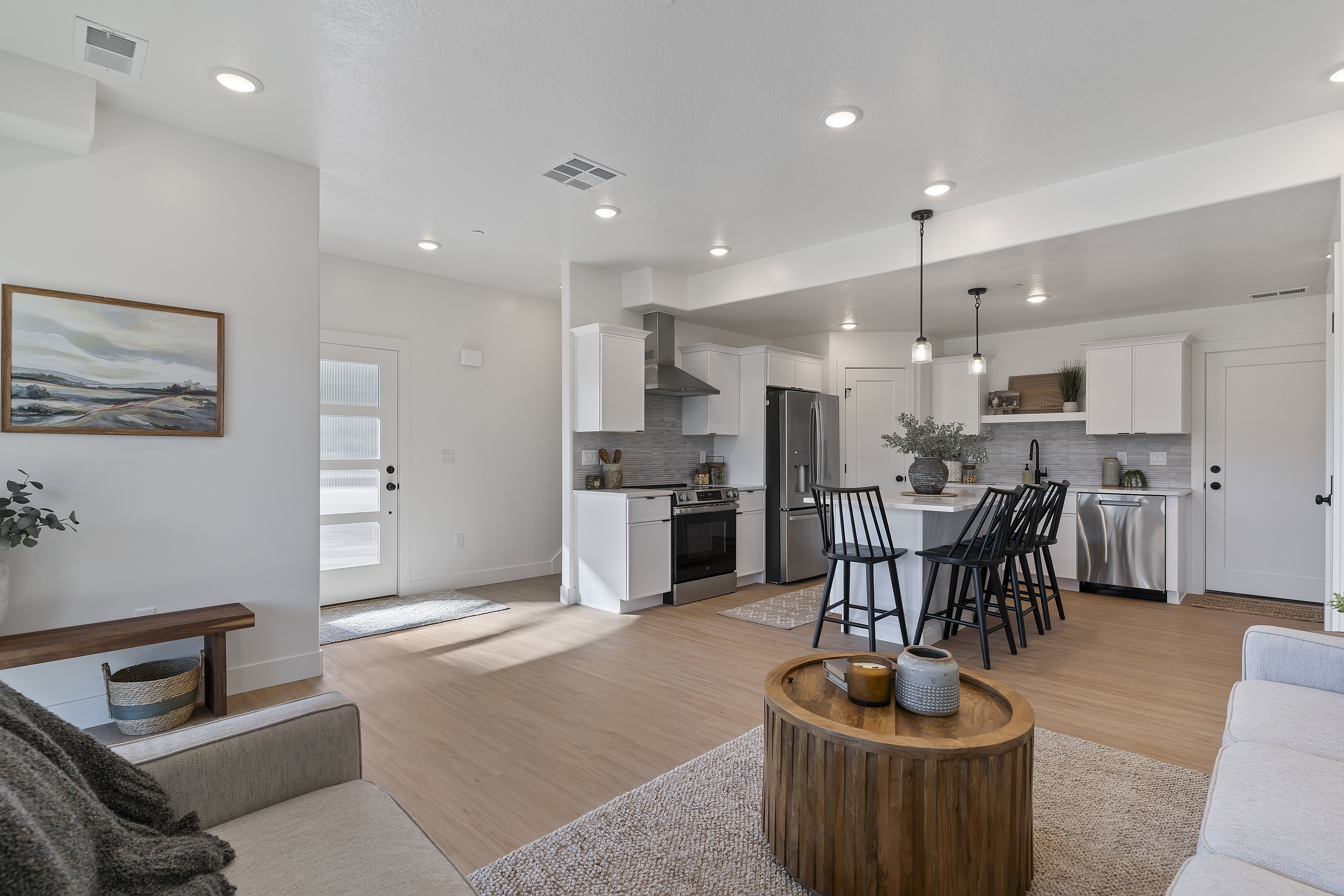 Living area featuring light wood-style flooring and baseboards