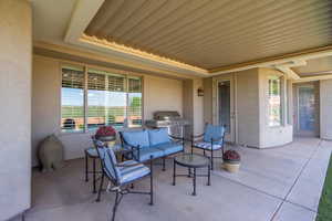 View of patio / terrace featuring outdoor furniture and a grill