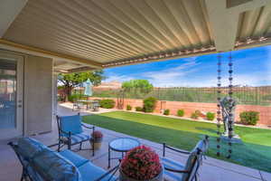 Fenced backyard with a patio area and a mountain view