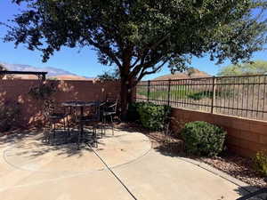 Fenced backyard featuring a patio and outdoor dining space
