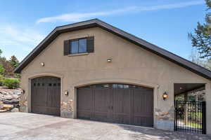 View of front of home featuring driveway and stucco siding